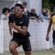 Paulo André enquanto corre na pista do CT Paralímpico em São Paulo