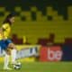 Angelina jogando com a seleção brasileira de futebol feminino