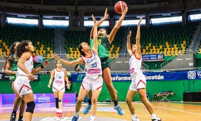 Na imagem, jogadora do Brasil cercada por adversárias de Porto Rico tentando o arremesso.