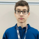 Allan Leite pousa para foto no Mundial Cadete de taekwondo