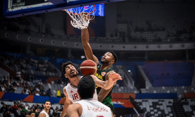 Caboclo enterra bola durante jogo Brasil e Irã na Copa do Mundo de basquete masculino