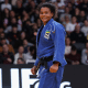 Ellen Froner está com judogi azul e sorri para foto; ela disputará o Grand Prix de Portugal de judô