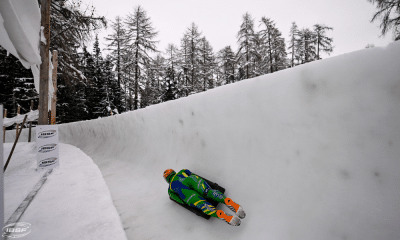 Nicole Silveira em ação na Copa do Mundo de skeleton em St. Moritz, com árvores ao fundo