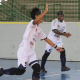 Tiago Paraná corre com os braços para cima e sorrindo durante comemoração de seu gol diante da Apadv; ao fundo, Jefinho corre batendo palmas e vibrando com gol do Maestro. Foto: Renan Cacioli/ CBDV.