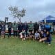 Atletas reuniundo posando em frente o local das provas de K1, K2 e C1