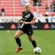 Jogadora do Gotham jogando uma partida da NWSL