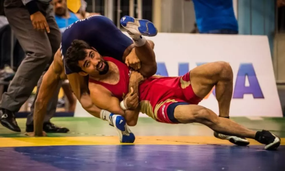 Marat Garipov em ação durante uma luta de wrestling